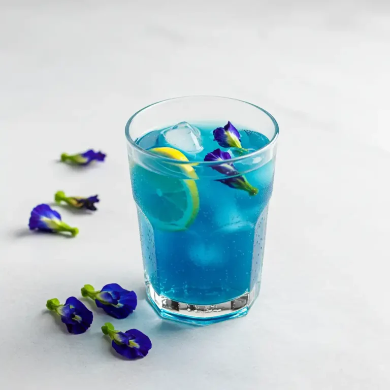 Mounjaro Liquid Recipe: Brazilian Butterfly Pea Drink for Natural Weight Loss & Detox 48 Mounjaro liquid recipe with butterfly pea flower, lemon, and apple cider vinegar in a glass